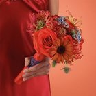 Mixed Orange Bridesmaid Bouquet from Olney's Flowers of Rome in Rome, NY